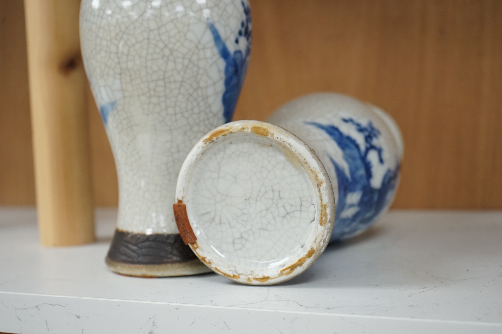 A pair of Chinese blue and white crackle glaze vases, late 19th century, 26cm high